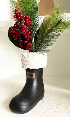 a black boot with a christmas decoration on it