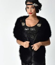 We’re not cold, we’re glamorous, gals! Make an elegant moment in any frock with this soft black faux fur stole from Unique Vintage. The graceful fur wrap features a side opening to lend a helping hand in keeping your scarf in place while the chic black poly satin lining adds the perfect amount of posh! Available while supplies last Chic Black Fur Coat With Feather Trim, Black Party Outerwear With Feather Trim, Chic Black Fur Coat With Faux Fur Trim, Elegant Feather Trim Outerwear For Night Out, Glamorous Fitted Faux Fur Coat, Elegant Outerwear With Feather Trim For Night Out, Elegant Evening Outerwear With Feather Trim, Glamorous Faux Fur Coat With Fur Trim, Glamorous Faux Fur Coat With Trim