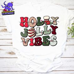 Product details: ✔️ NAME: Holly Jolly Vibes Shirt, Christmas Sweatshirt, Holly Jolly Sweatshirt, Holly Jolly Vibes Shirt, Christmas Crewneck ✔️ IMPORTANT NOTE: Both Men and Women can we our shirts because this is unisex style t-shirts;  Wash item inside out in cold water, do not bleach, do not dry clean, do not iron directly on the design. ✔️ MATERIAL: 5.3-ounce, 100% cotton (99/1 cotton/poly (Ash) & 90/10 cotton/poly (Sport Grey); Heavyweight classic unisex tee; Taped neck and shoulders; Tearaw Holly Jolly Vibes, Christmas Crewneck, Tee Shirt Designs, Holly Jolly, Christmas Sweatshirts, Unisex Fashion, Sweat Shirt, Inside Out, Shirt Designs