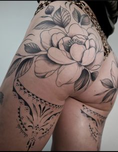 the back of a woman's thigh with flowers on it