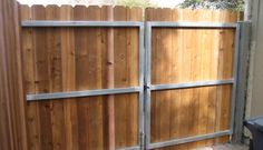 a wooden fence with metal bars on it