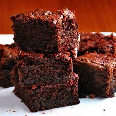 chocolate brownies stacked on top of each other