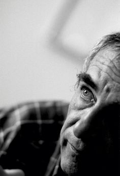 black and white photograph of an older man looking up