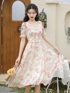 Get tea party ready this summer in this lightweight chiffon printed midi dress with a square neckline, braided details, short puff sleeves, flecks of gold and concealed back zipper. Lined. S: 33" chest, 27" waist, 44" lengthM: 34.5" chest, 28.5" waist, 44" lengthL: 36" chest, 30" waist, 44" length Feminine Chiffon Dress With Square Neck, Spring Chiffon Midi Dress With Square Neck, Spring Square Neck Chiffon Midi Dress, Chiffon Midi Dress With Square Neck, Spring Chiffon Midi Dress With Puff Sleeves, Feminine Flowy Short Sleeve Midi Dress, Short Sleeve Chiffon Midi Dress, Casual Chiffon Square Neck Dress, Casual Square Neck Chiffon Dress