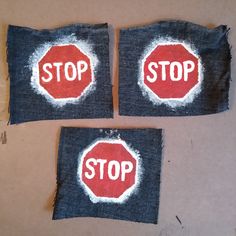 two pieces of cloth with the words stop painted on them