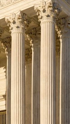 the supreme court building in washington d c, with columns and pillars on both sides