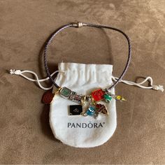 Authentic Pandora Purple Leather Bracelet Wrap Around Wrist Twice / Necklace With 9 Brand New Harry Potter Themed Charms 925 Sterling Silver Clasp & Leather Charms Are All Brand New (Unbranded) Pandora Bracelet Is Authentic. Great Condition. 925 Sterling Silver And Leather Bracelet. Very Pretty Bracelet Set. Perfect For Harry Potter Fan! Please Review All Photos For Details. Beautiful Set! Great Condition. Can Wear As A Bracelet Or Necklace! Total Length Is 15” Twice Necklace, Leather Charms, Pandora Harry Potter, Pandora Purple, Harry Potter Charms, Harry Potter Collection, Pandora Silver, Pretty Bracelets, Purple Leather