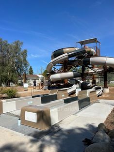 an outdoor water park with several slides