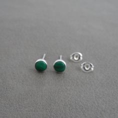 A darling pair of simple Malachite Stud Earrings in Sterling Silver. These earrings are made with a 5mm malachite stone and sterling silver. Your choice of either a plain bezel or serrated bezel. Your earrings will come with sterling silver butterfly backs. Mix and match with my other stud earrings *Please note as with all natural gemstones the color may vary from the pair shown. Great for sensitive ears! This listing is for one pair of earrings. Earrings are shipped in a gift box. Malachite Stud Earrings, Malachite Earrings, Malachite Stone, Earrings Dainty, Earrings Green, Stone Studs, Silver Butterfly, Earrings Minimalist, Dainty Earrings