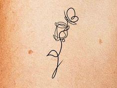 a drawing of a flower on a piece of paper with the word love written in it