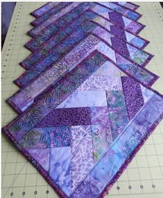 the quilts are laid out and ready to be sewn together on the table