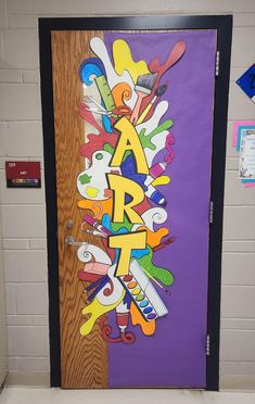 the door to an art class is decorated with colorful letters