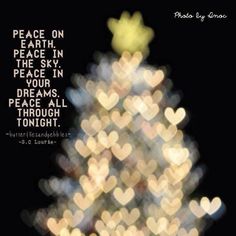 a christmas tree with lights in the background and a quote on it that says, peace on