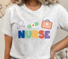 a woman wearing a nurse t - shirt with the word nurse printed on her chest