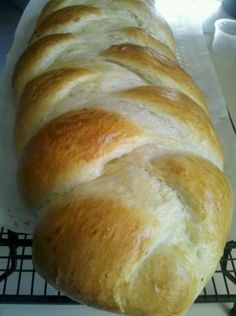 a loaf of bread sitting on top of a cooling rack