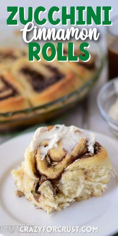 a small cinnamon roll with icing on top while it is sitting on a white plate with words on the photo saying the name of the recipe Zucchini Breakfast, Fluffiest Cinnamon Rolls, Zucchini Rolls, Zucchini Side Dishes, Cinnamon Roll Bread, Easy Zucchini Recipes