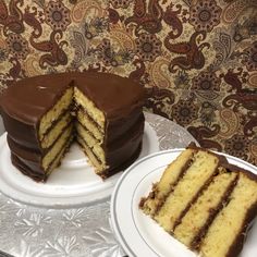 two plates with slices of cake on them and one has a slice missing from it