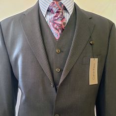 Calvin Klein Made In Canada, Where Their Nicer Collections Are Made. This Modern 3 Button 3 Piece Suit Is Made Of 98% Wool 2% Xla. This Suit Is Made For The Active Guy Who Likes Luxurious Feeling Garments. 3 Piece Suits, Mens Suits, Blazer Suit, 3 Piece, Blue Grey, Calvin Klein, Man Shop, Wool, Grey