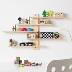 there is a shelf with toys on it in the living room or children's room