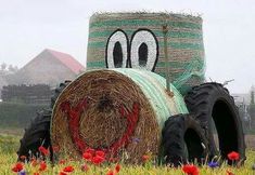 there is a large hay bale with a face on it