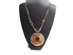 This necklace measures 16 inches long but it has an adjustment chain of 4 inches for added length. The beads are brown wood and copper-colored metal beads. The abalone (mother-of-pearl pendant measures 2 inches long and wide. Abalone Shell Necklace, Metal Bead, Shell Necklace, Abalone Shell, Shell Necklaces, Copper Color, Brown Wood, Metal Beads, Pearl Pendant