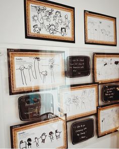 several framed drawings are on the wall