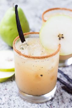 an apple cider cocktail with cinnamon garnish on the rim