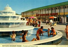 an old postcard shows children playing in the fountain and swimming pool at bultu's bonior