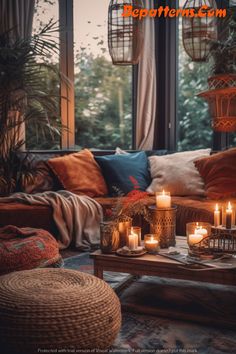 a living room filled with lots of furniture and candles on top of a coffee table