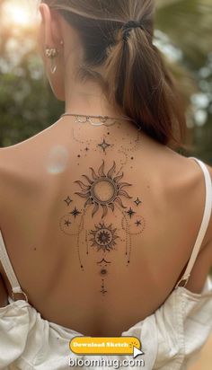 the back of a woman's neck with sun and stars on it