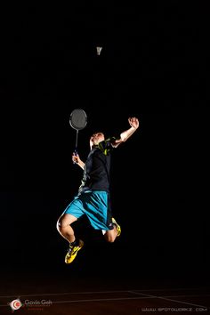 a man jumping up in the air with a tennis racket and racquet