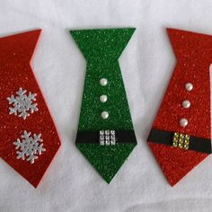 three christmas ties with snowflakes on them