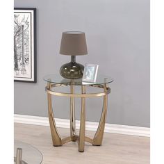 a glass table with a lamp on top