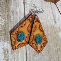 -Choice picked matching Deep Blue -Turquoise Inlay -Western Tooled Leather  -Saddle Tanned  -Surgical Steel Hooks #Find more of my rustic hand made designs https://www.etsy.com/shop/KCsDesignsShop Bohemian Hand-tooled Leather Earrings, Bohemian Turquoise Leather Earrings, Handmade Turquoise Leather Earrings, Handmade Leather Earrings In Turquoise, Handmade Leather Turquoise Earrings, Handmade Southwestern Leather Earrings, Handmade Western Turquoise Earrings, Bohemian Turquoise Hand-tooled Earrings, Blue Bohemian Hand-tooled Earrings