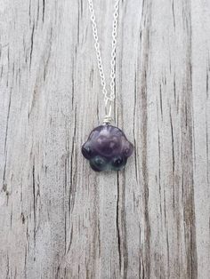 "This paw necklace features a piece of natural Rainbow Fluorite carved in paw print shape.  You will get a random piece from the ones shown in the pictures unless you contact me and choose your own paw. The actual paws are much brighter and prettier in person! The paws are drilled, and wire wrapped by Eva with 22-gauge solid sterling silver. You can choose just a paw, or you can choose to have sterling silver chain (as featured picture) or stainless-steel chain, with your choice of chain length. Round Pendant Necklace With Paw Print For Gift, Sterling Silver Paw Print Necklace For Gift, Sterling Silver Paw Print Necklace As Gift, Paw Print Pendant Necklace For Gifts, Paw Print Pendant Necklace For Gift, Paw Print Pendant Necklace Gift, Pendant Necklace With Paw Print For Gift, Paw Pendant, Paw Print Pendant