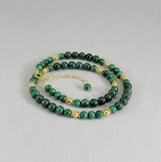 Vibrant green polished malachite beads in two sizes are interspersed with decorative vermeil spacers and shiny 14 karat gold filled beads. This statement necklace closes with a gold filled spring ring and adjustable chain for a finished length of 18 to 20 inches (46 to 51 cm). You can choose the shorter length of 16 to 18 inches (41 to 46 cm) if you prefer. Gorgeous bright green gemstone beads and quality findings make this necklace perfect for career wear and special evenings. The adjustable le Green Gemstone Necklace, Green Gemstones, Beaded Necklaces, Everyday Jewelry, Gold Filled Jewelry, Bright Green, Teardrop Earrings, Bead Necklace, Spring Rings