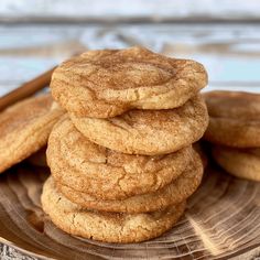 a stack of cookies sitting on top of a wooden plate