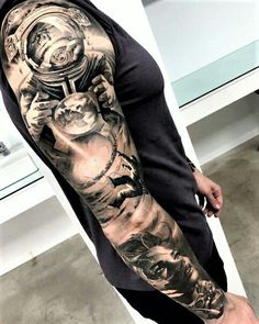 a man with a full sleeve tattoo on his arm