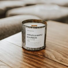 a candle sitting on top of a wooden table