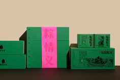 three boxes are stacked on top of each other with chinese characters painted on the side