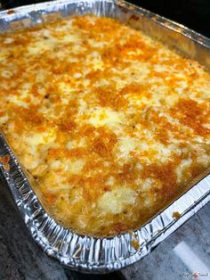 a cheesy casserole in a metal pan