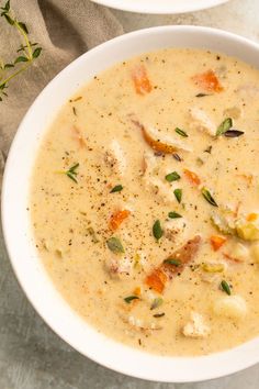 two bowls filled with soup on top of a table