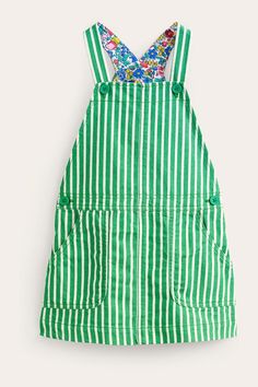 Denim, dungarees and a floral lining all combined into one dress? We're sold. It's primed for Minis' adventures throughout the season and beyond; plus, there's even a duo of pockets so they can stash their treasures. Machine washable. 98% Cotton, 2% Elastane. Runner Beans, Dungaree Dress, Denim Dungarees, Boden Dress, Kids Denim, Mid Dresses, Overall Dress