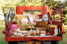 a red truck filled with lots of food and drinks