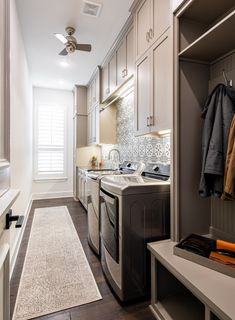 a washer and dryer in a small room