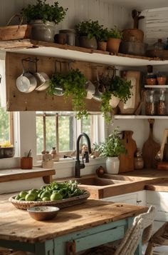 a kitchen filled with lots of pots and pans on top of shelves next to a sink