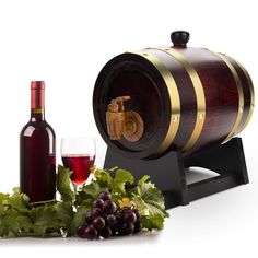 a wine barrel and some grapes next to it