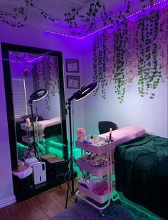 the room is decorated with purple lights and green bedding, along with a large mirror