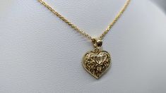 Just in time for Valentines Day, our newest golden heart pendant makes the perfect gift for your significant other! Made with warm 10K yellow gold, and etched with mill grains for a lovely, high-detail style. The pendant itself is 17x12mm, and comes with 1 classy 1mm 10K gold cable chain.  The pendant is ready for shipping, and comes with a cute jewelry box! Thank you for visiting MJW Black Diamond Jewelry - Celebrating over 20 Years of Business! We are a family-owned business founded in Chicago Cute Jewelry Box, Hogwarts Dr, Black Diamond Jewelry, Gold Heart Studs, Pretty Accessories, Gold Heart Pendant, Golden Heart, Heart Pendant Gold, Jewelry Lookbook