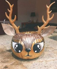 a deer head painted on top of a kitchen counter